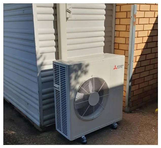 FHC install: outdoor condenser close-up on a mounting bracket, Coffs Harbour
