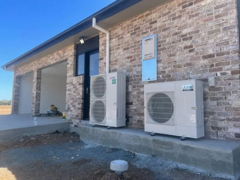 FHC install: neat outdoor condenser installation on a paved area, Coffs Harbour